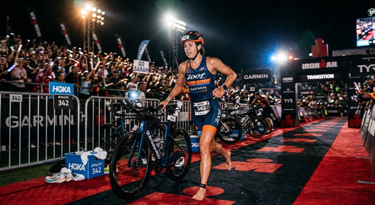 Professional triathlete performing a rapid bike-to-run transition in a high-speed stadium setting with dramatic cinematic lighting.