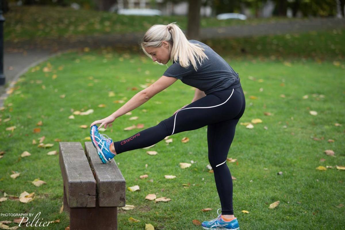 stretching legs running recovery rest day