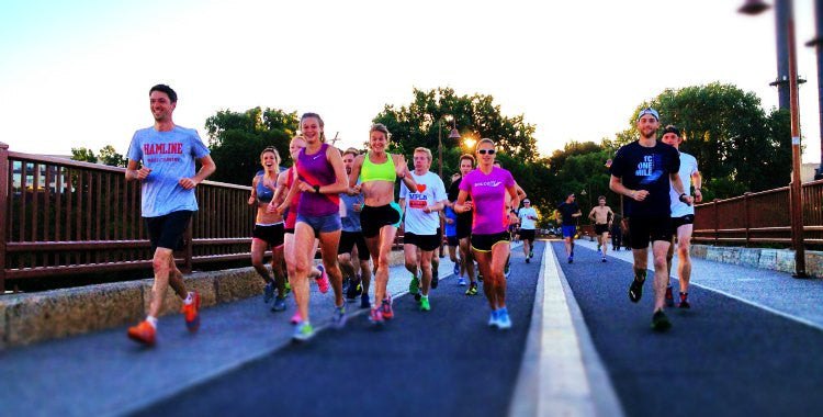 Group Running Across A Bridge Run Club