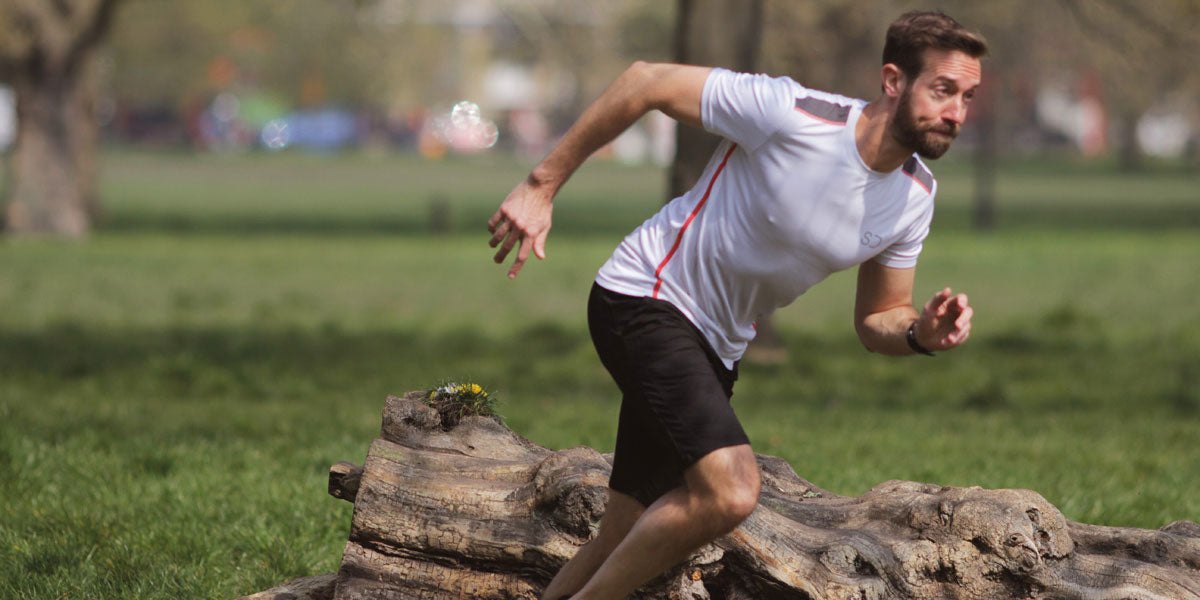 man running fast in a park