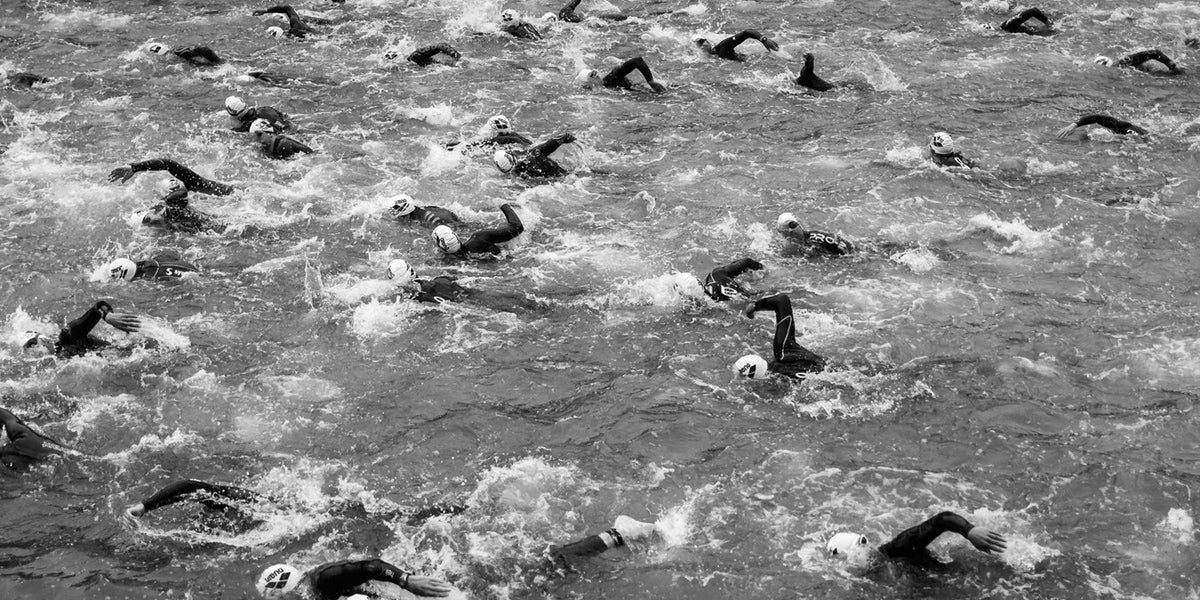 triathlon mass swim start wetsuit swimmers