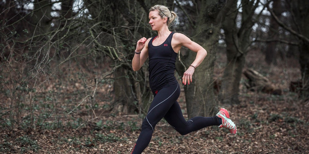 Athletic woman running outdoors