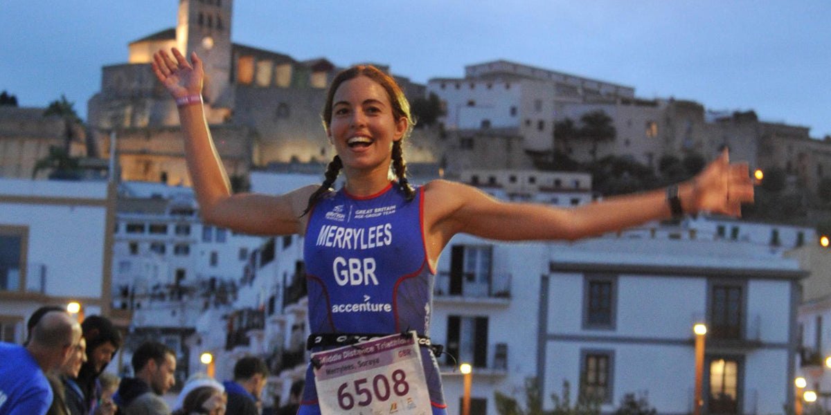 triathlete running finish line race