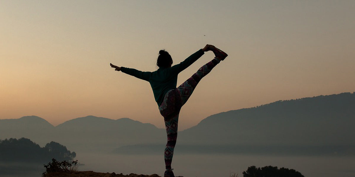 Mountain top yoga position Sundried yoga clothing women's