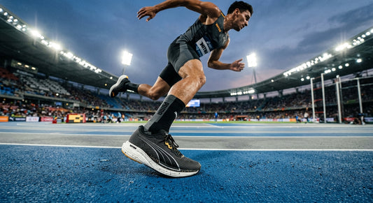 A professional action shot of the Puma Velocity Nitro 5 in motion, showing sharp details of the nitrogen-infused foam midsole and engineered mesh texture under cinematic stadium lighting.