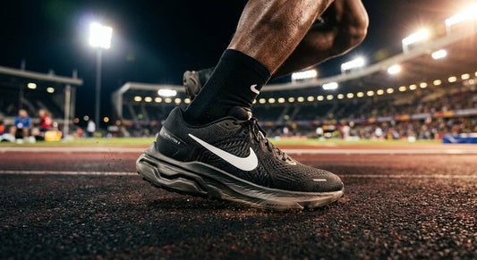 A close-up of the Nike Revolution 9 prototype showcasing the intricate texture of the engineered mesh upper and the sculpted midsole geometry under cinematic stadium lighting.