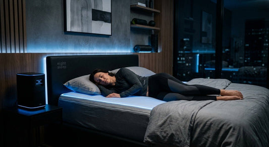 A sleek, high-tech bedroom featuring the Eight Sleep Pod with soft blue ambient lighting, showcasing a modern, minimalist aesthetic for recovery.