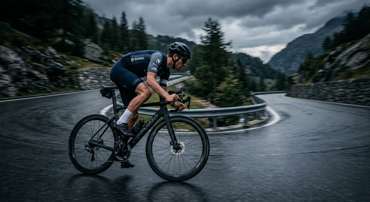 A professional cyclist in a tuck position, captured with motion blur and high-speed photography on a dramatic, moody road.