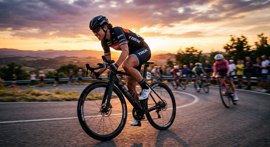 A professional cyclist sprinting on a carbon fibre road bike during a sunset race with dramatic lighting and motion blur