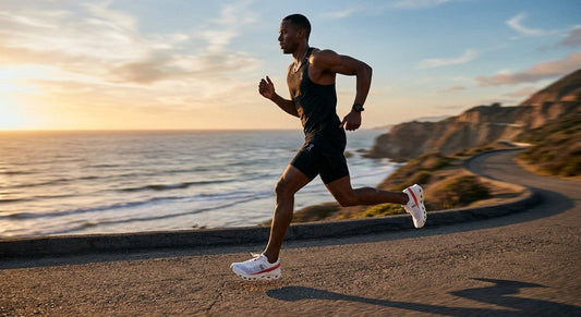 A side profile view of the sleek On Running Cloudboom Max showcasing the high-stack foam midsole.