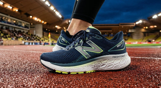 A close-up of the New Balance Fresh Foam X 860 v16 showing the textured midsole and engineered mesh upper in a dramatic stadium setting.