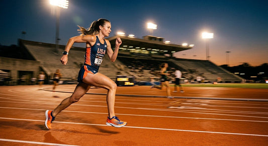 A professional runner sprinting on a track at dusk, wearing high-performance marathon shoes with cinematic stadium lighting and motion blur.