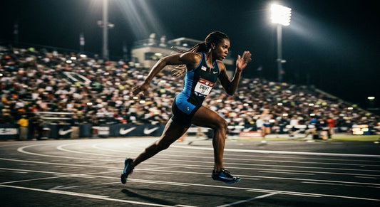 A professional sprinter in a blurred motion shot, captured with cinematic stadium lighting and high-contrast dramatic shadows.