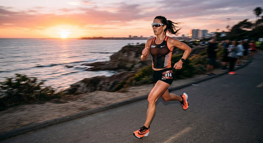 Professional high-speed shot of a runner wearing sleek rimless sunglasses during a sunset training session with motion blur.