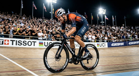 Professional cyclist in a high-speed sprint finish, captured with sharp focus and dramatic stadium lighting.