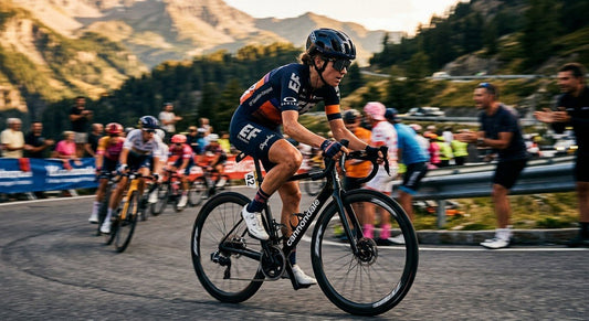 A professional cyclist wearing Oakley Sutro Lite sunglasses during a high-speed road race with motion blur