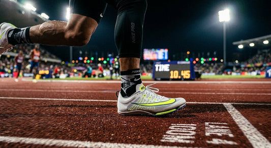 A close-up of a high-performance athletic shoe on a track with dramatic stadium lighting and motion blur.