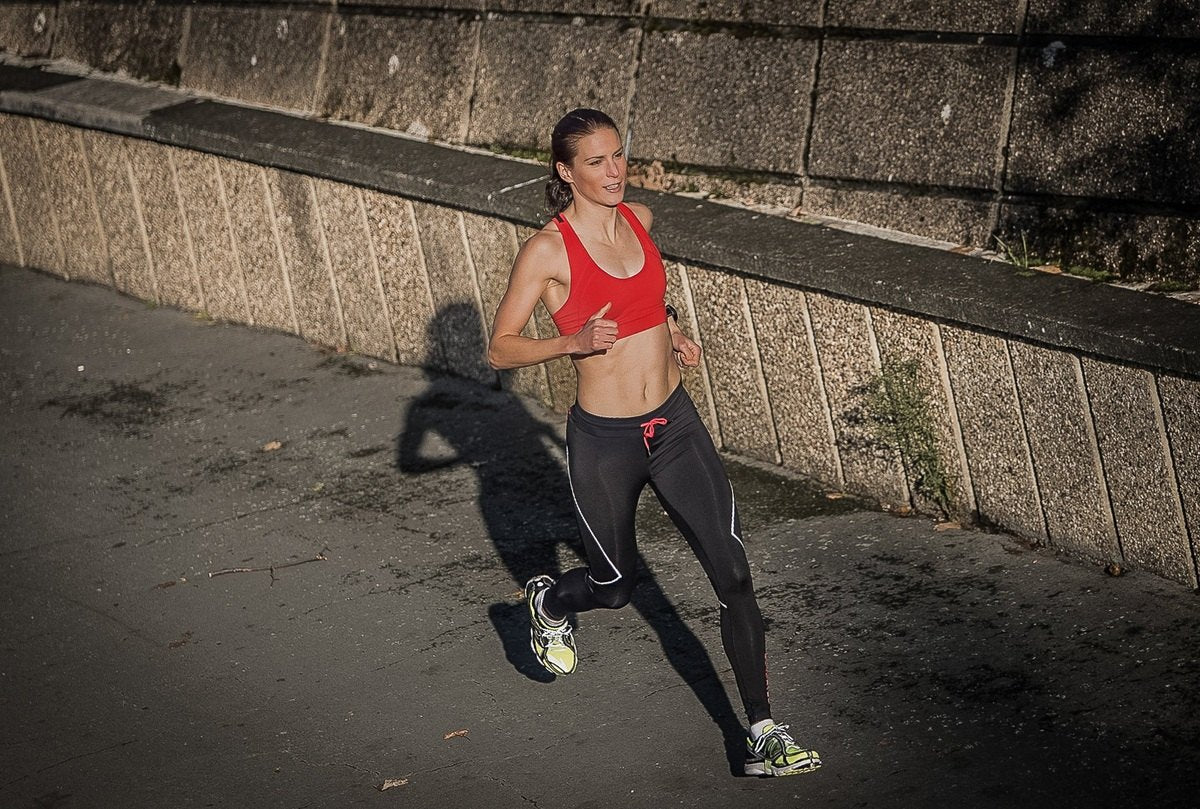 Running Sprinting Happy Smiling Woman Sports Bra
