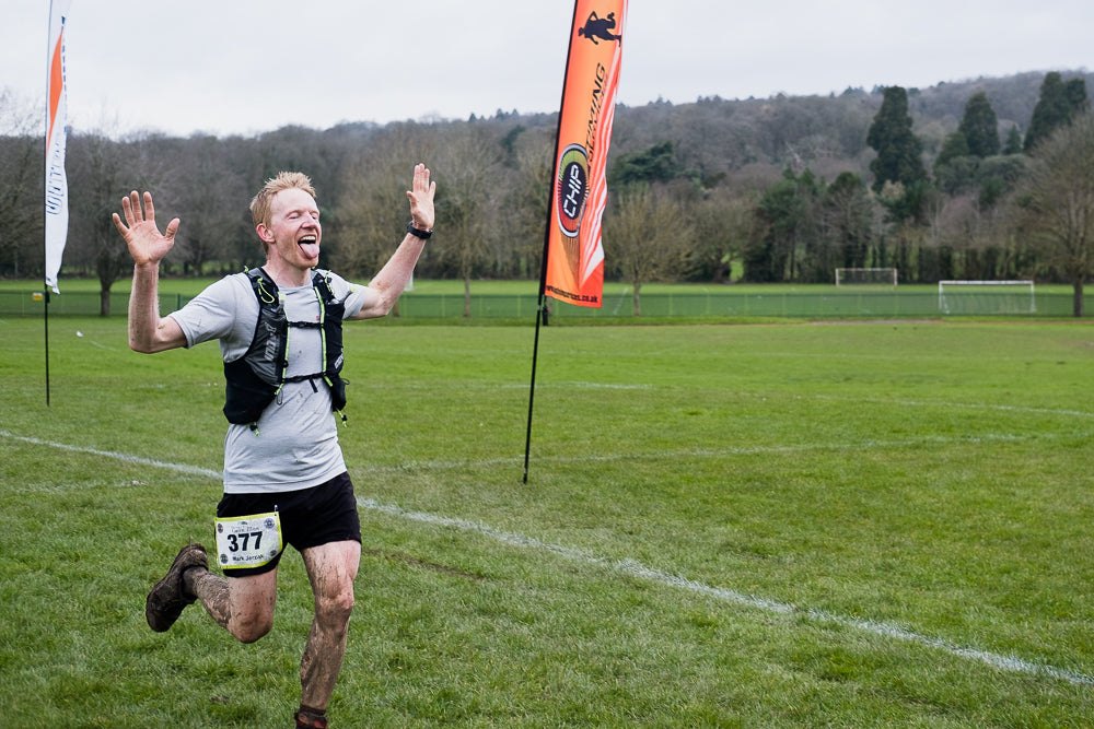 ultra marathon running trail race winner finish line Sundried activewear