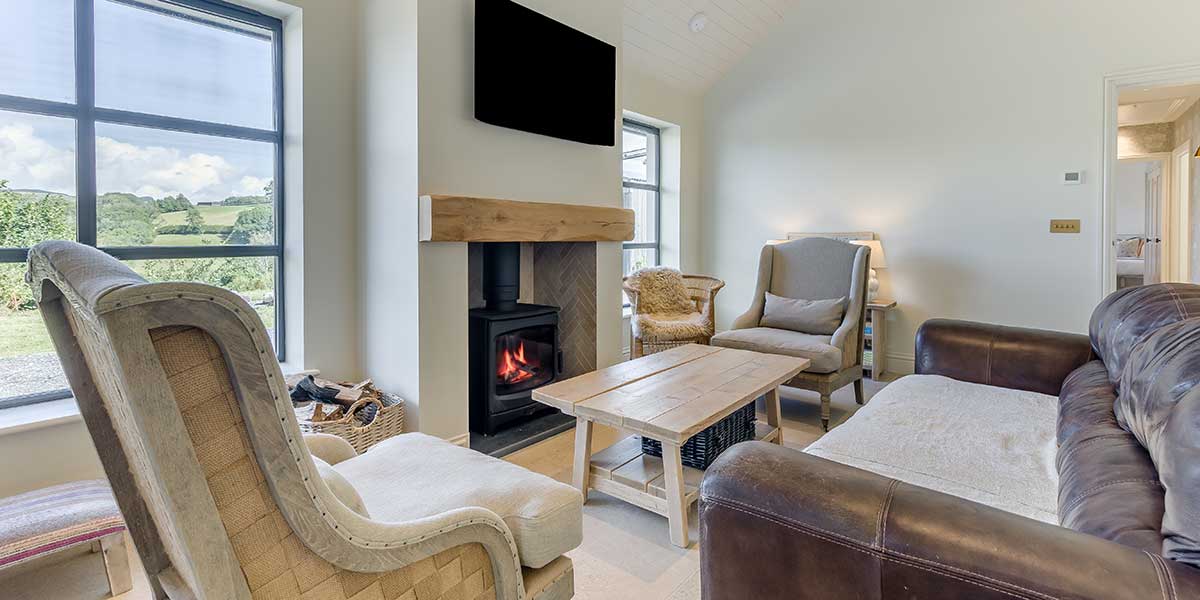 A cozy fire pit setting in the garden of Tyle Glas Wales