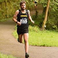 Runner tying laces on carbon plate shoes