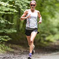 Athlete doing squats in gym