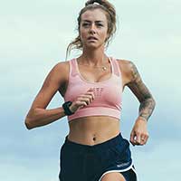 Runner applying ice to knee