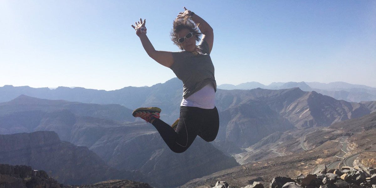 Non-Scale Victories Sundried Ambassador Jumping on a mountain adventurer