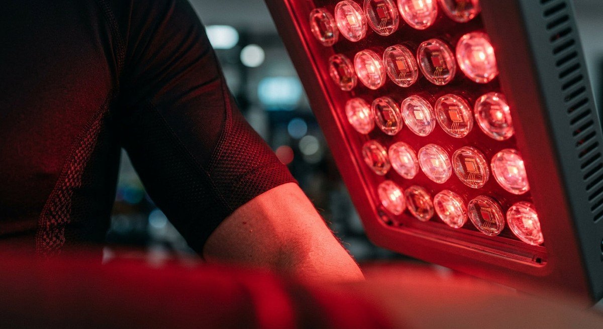 A close-up, high-speed photograph showing the sharp, fine details of medical-grade LED diodes on a red light therapy panel during operation.