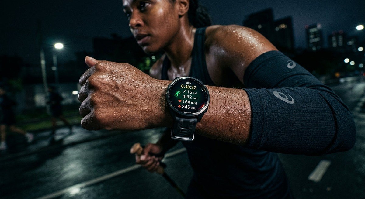 A close-up of a high-tech sports watch on a runner's wrist, showing detailed health metrics against a dark, moody background with realistic skin textures and sweat droplets.