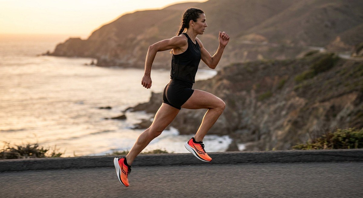 A side-profile shot of a runner showcasing the aggressive rocker geometry of the Velociti Pro 2 at peak performance.