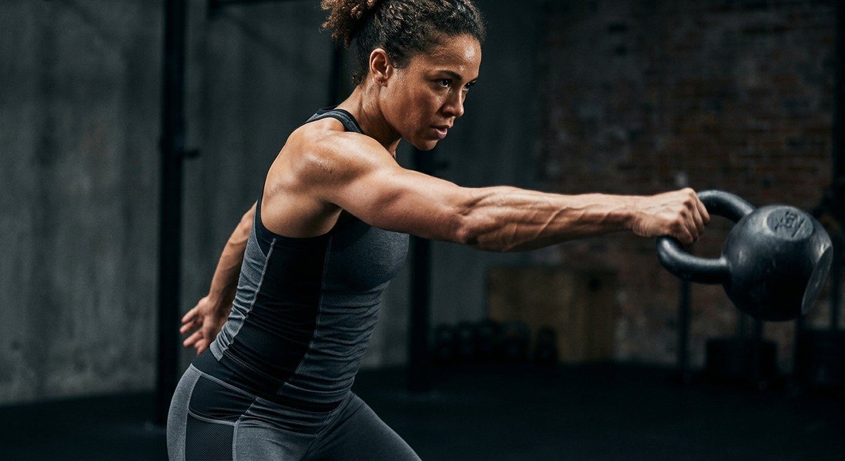 Close-up of a high-speed athletic movement showing intense muscle engagement and sharp, realistic textures in a dark, moody environment.