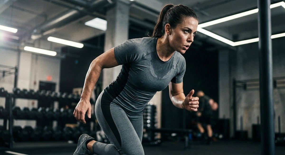 Close-up of a professional athlete wearing high-performance moisture-wicking gear during a high-intensity training session.