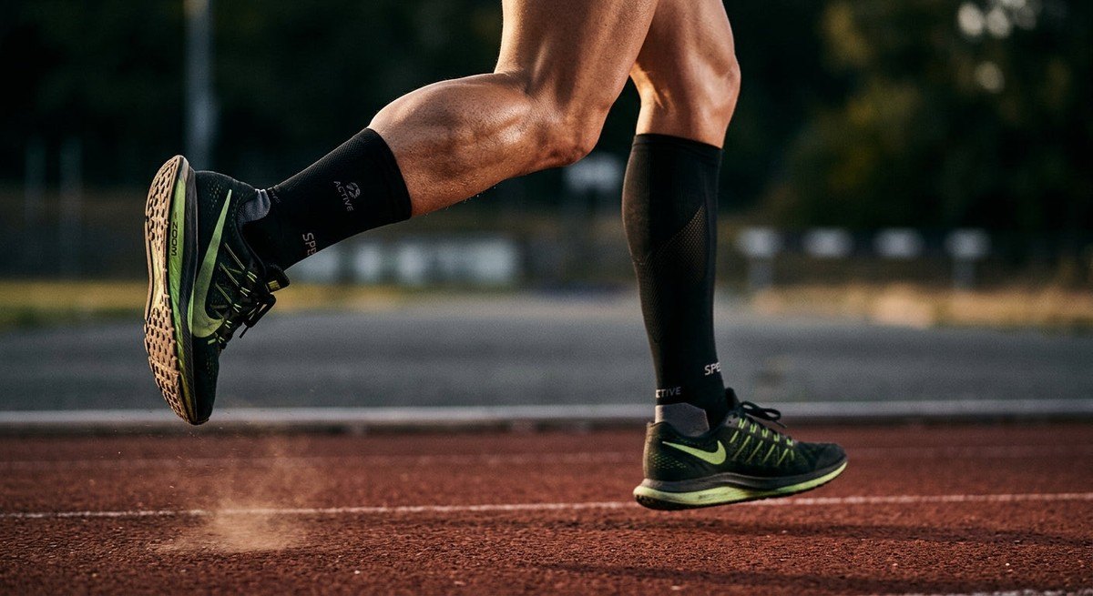 Close-up of a runner's lower leg mid-air, capturing the tension in the Achilles tendon and realistic muscle texture