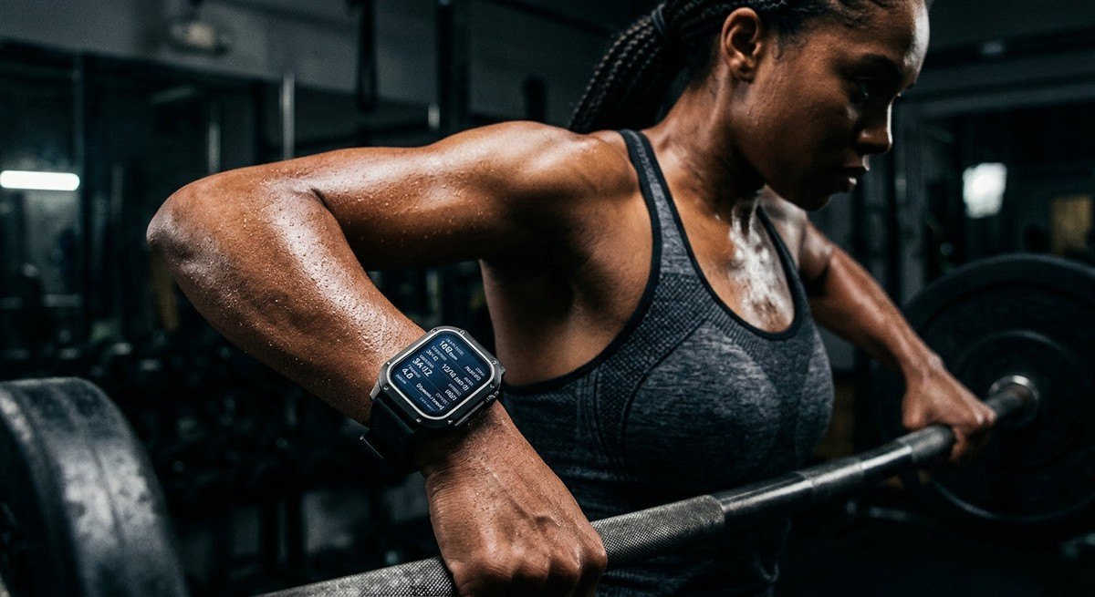 Close-up of a wearable fitness device displaying complex health metrics with a dark, cinematic background and sharp, high-contrast lighting.