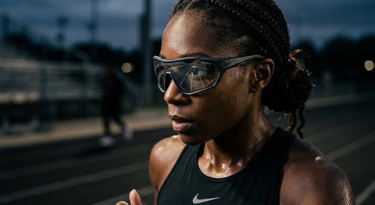 Close-up of the Nike Vision Prima Icon frame showing the detailed material texture and aerodynamic lens geometry under moody lighting.