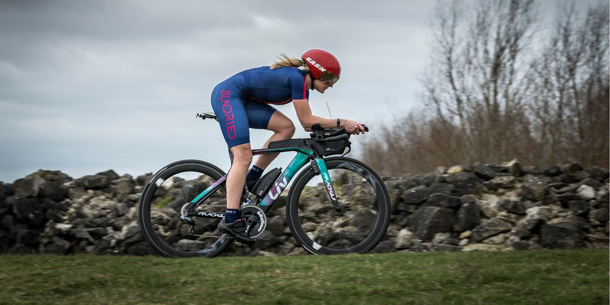Female Athlete Cyclist Cycling in Sundried Cycle Triathlon Trisuit 