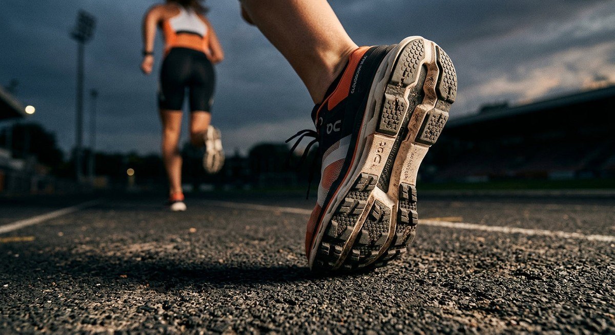 Close-up of the textured rubber outsole on the On Running Cloudboom Max designed for high-performance traction.