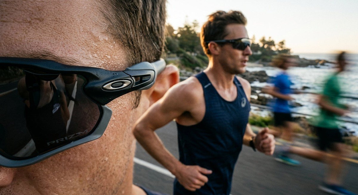 Macro shot of aerodynamic sports eyewear frame details with motion blur of a runner in the background.