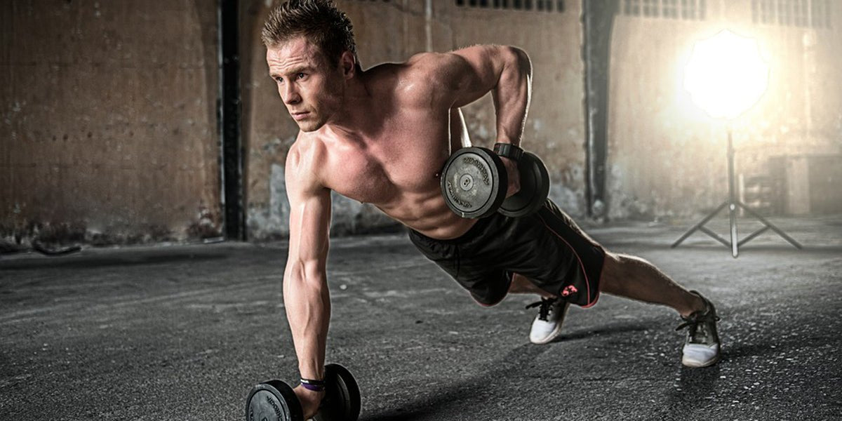 muscular man lifting weights