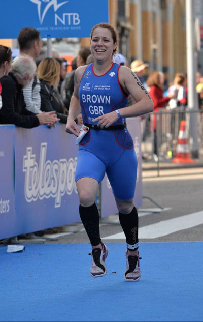 triathlete running finish race