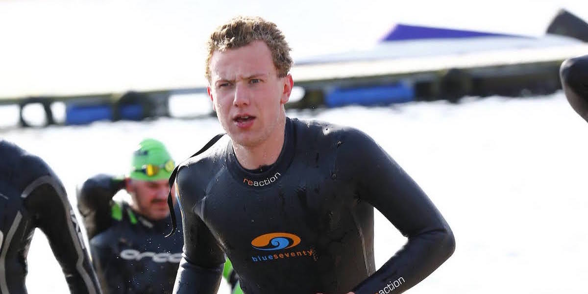triathlete running swim wetsuit