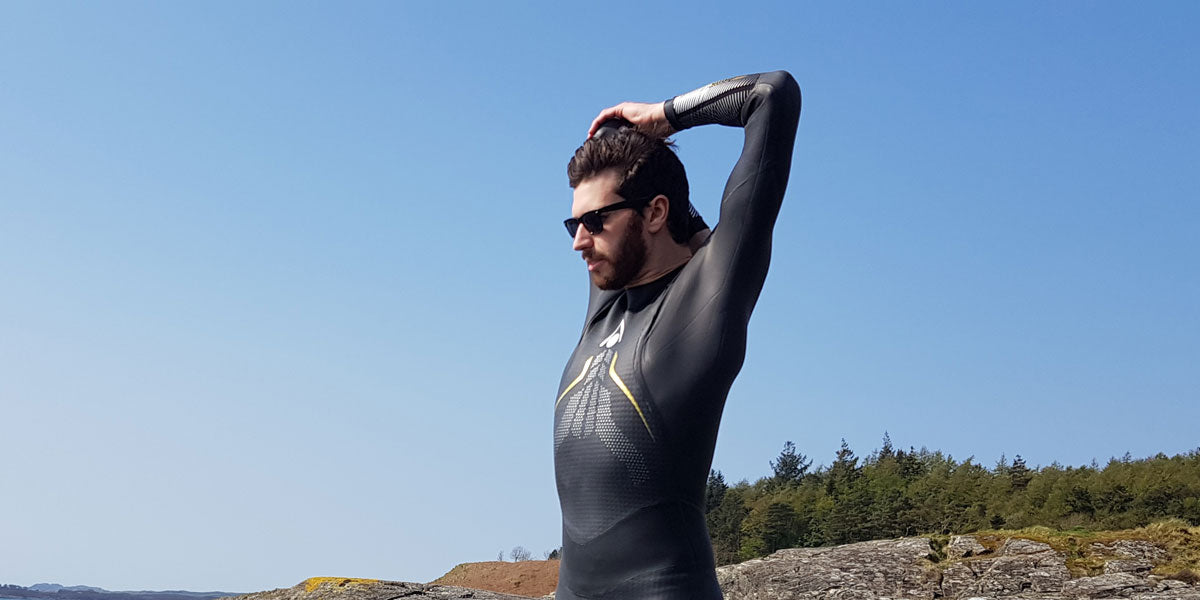 triathlete stretching wetsuit swim