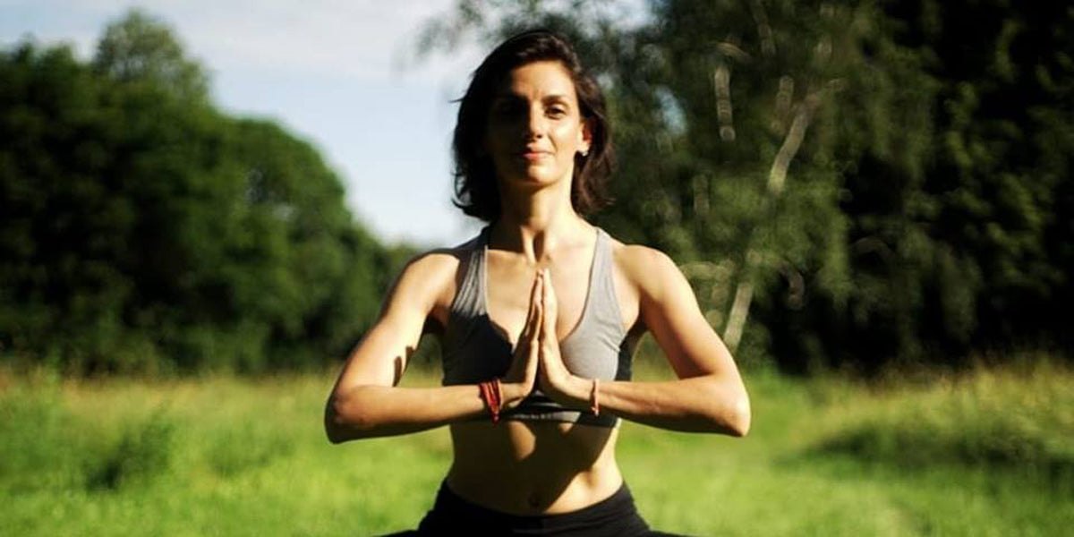yoga instructor outdoors fitness